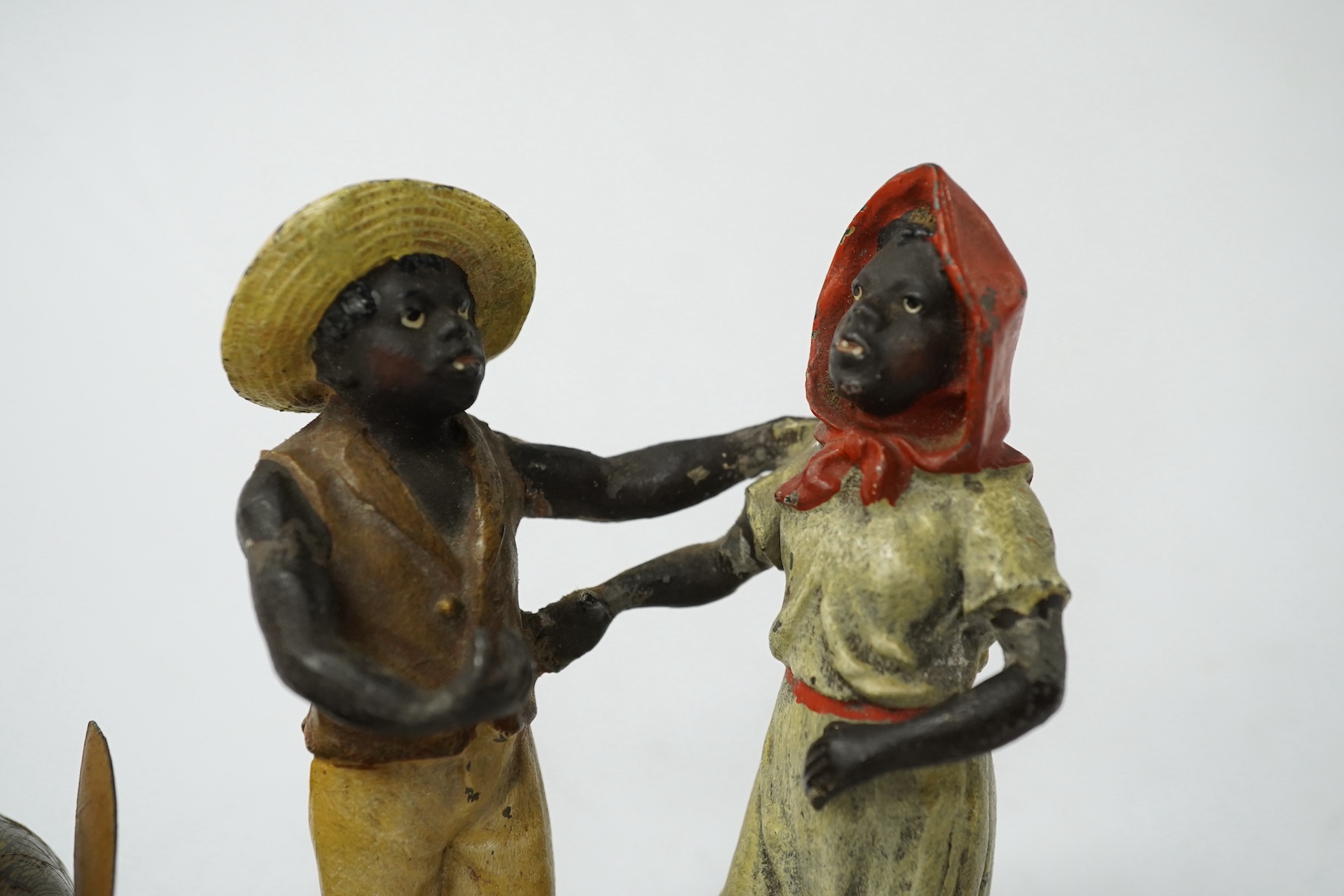 A collection of cold-painted figures and a tinplate and clockwork hare, largest 10cm high. Condition - fair
